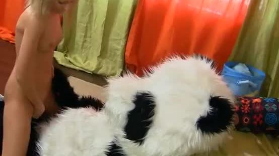 Sexy girl having fun with her panda bear