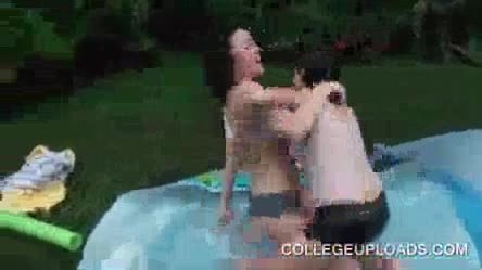 Party girls kissing and fucking in plastic pool