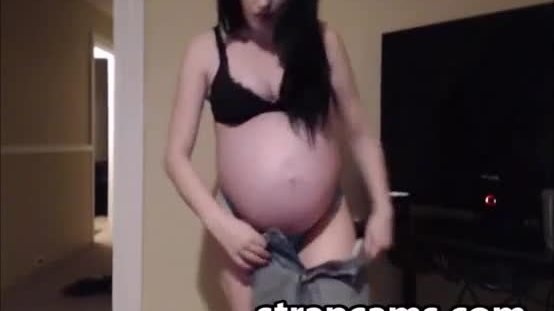 Pregnant brunette teen shows off